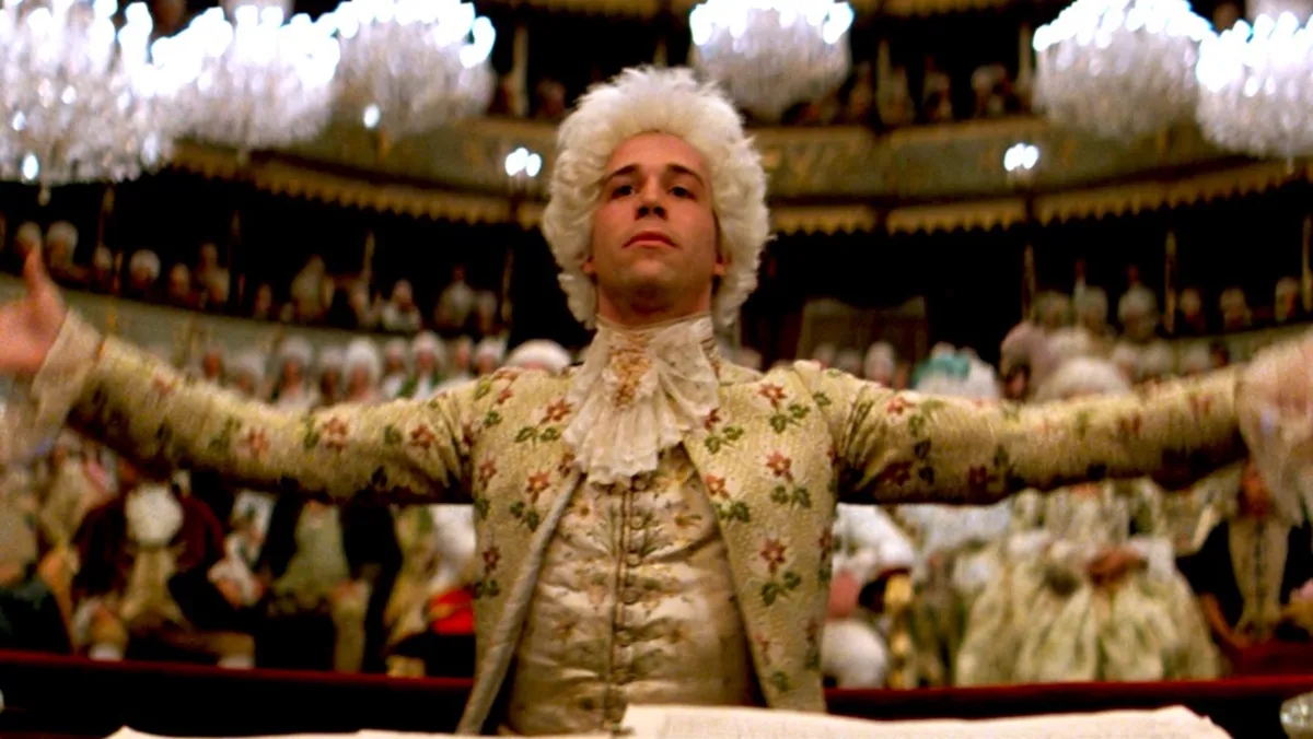 Tom Hulce as Wolfgang Amadeus Mozert directing a performance in "Amadeus"