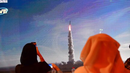 A picture taken on July 19, 2020, shows a screen broadcasting the launch of the 