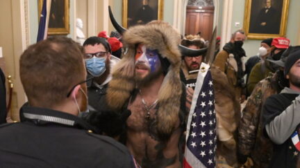 Supporters of US President Donald Trump, including member of the QAnon conspiracy group Jake A, aka Yellowstone Wolf (C), enter the US Capitol on January 6, 2021, in Washington, DC