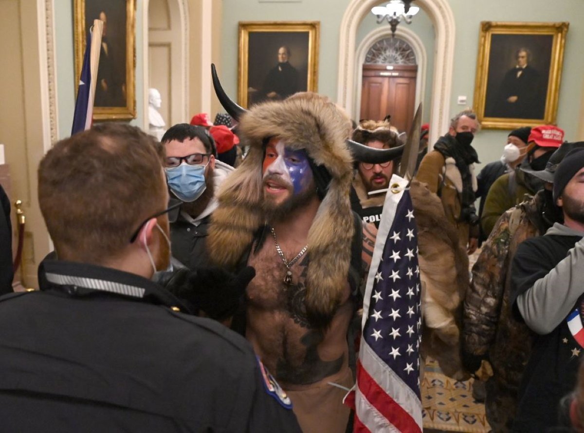 Supporters of US President Donald Trump, including member of the QAnon conspiracy group Jake A, aka Yellowstone Wolf (C), enter the US Capitol on January 6, 2021, in Washington, DC