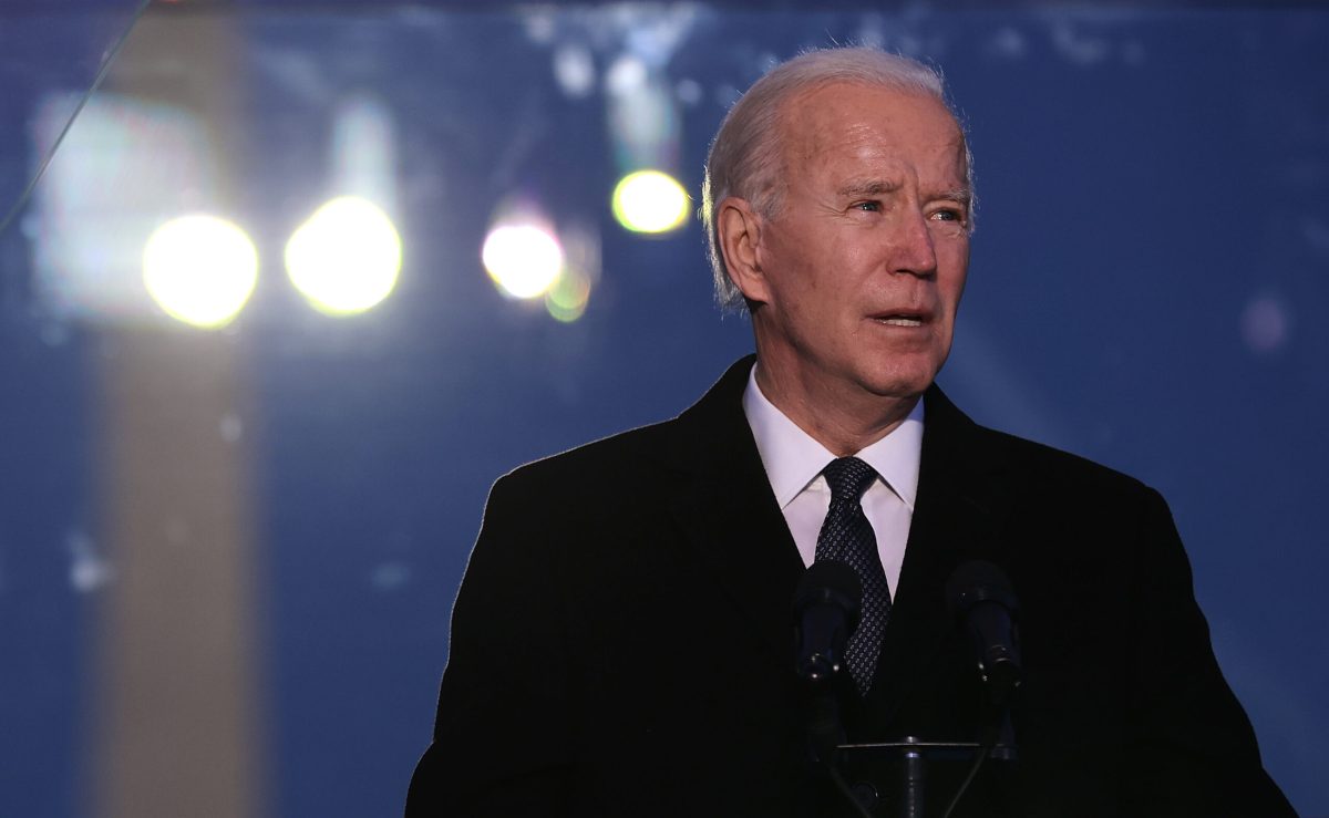 WASHINGTON, DC - JANUARY 19: U.S. President-elect Joe Biden delivers brief remarks during a memorial service to honor the nearly 400,000 American victims of the coronavirus pandemic at the Reflecting Pool in front of the Lincoln Memorial January 19, 2021 in Washington, DC. As the nation's capital has become a fortress city of roadblocks, barricades and 20,000 National Guard troops due to heightened security around Biden's inauguration, 200,000 small flags were installed on the National Mall to honor the nearly 400,000 Americans killed by COVID-19. (Photo by Chip Somodevilla/Getty Images)