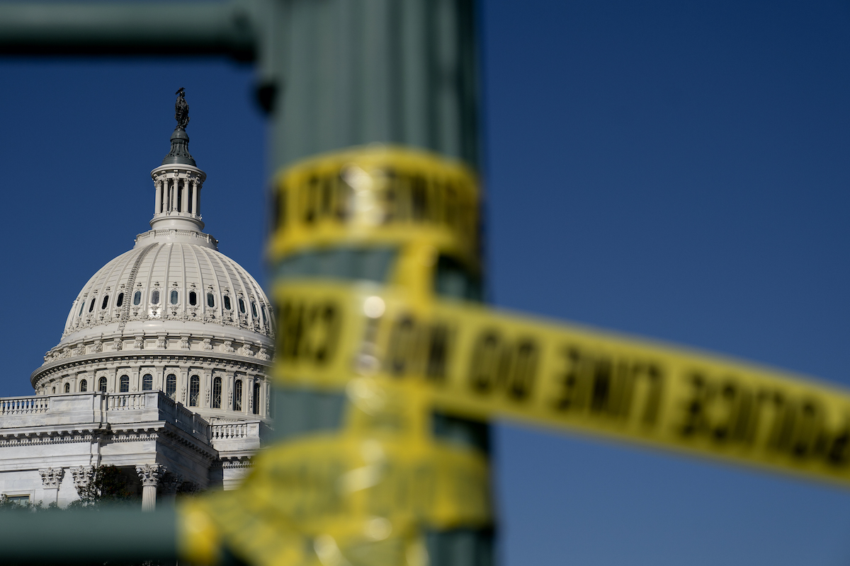 Police tape hangs near the U.S. Capitol