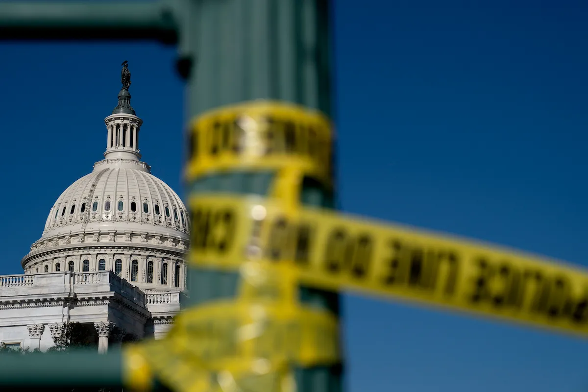 Police tape hangs near the U.S. Capitol
