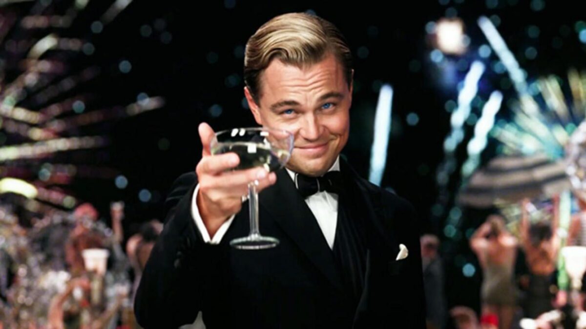 leo raises a glass in the great gatsby