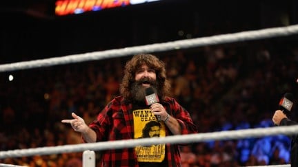 NEW YORK, NY - AUGUST 23: Mick Foley greets the audience at WWE SummerSlam 2015 at Barclays Center of Brooklyn on August 23, 2015 in New York City. (Photo by JP Yim/Getty Images)