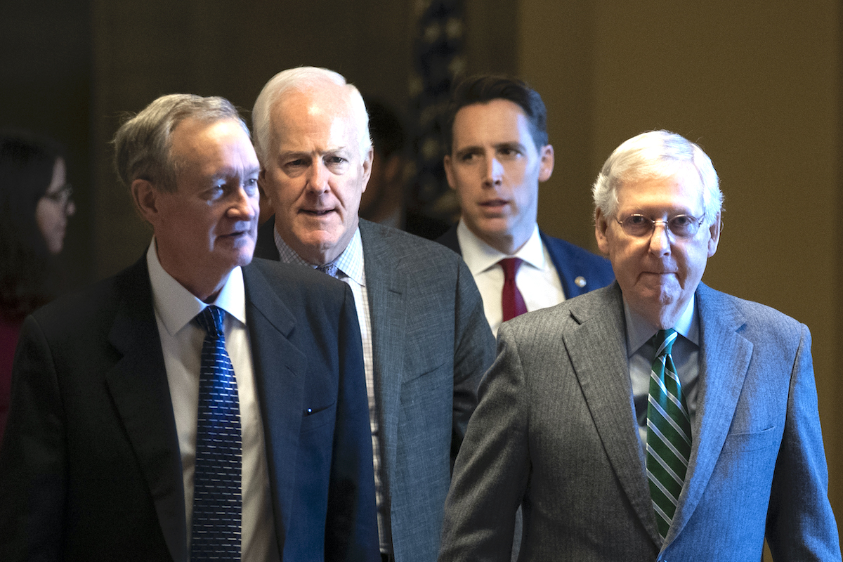 (L-R) Sen. Mike Crapo (R-ID), Sen. John Cornyn (R-TX), Sen. Josh Hawley (R-MO) and Senate Majority Leader Mitch McConnell (R-KY) leave McConnell's office and walk to the Senate chamber