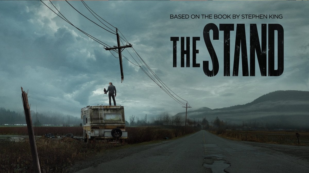 CBS The Stand adaptation image of a road and an RV with a man standing on it.