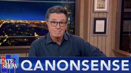 A still from The Late Show showing Stephen Colbert smirking above a chryon reading 