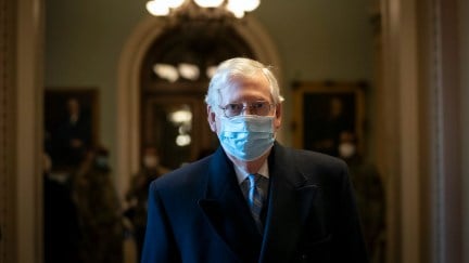 Senate Minority Leader Mitch McConnell (R-KY) walks to his office on the first day of former President Donald Trump's second impeachment trial