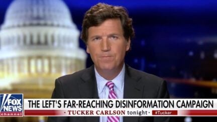 Tucker Carlson looks confused, as usual, above a chyron reading 