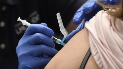A nurse practitioner administers a dose of the Moderna Covid-19 vaccine at a clinic for Catholic school education workers including elementary school teachers and staff at a vaccination site at Loyola Marymount University (LMU) on March 8, 2021 in Los Angeles, California. (Photo by Patrick T. FALLON / AFP) (Photo by PATRICK T. FALLON/AFP via Getty Images)