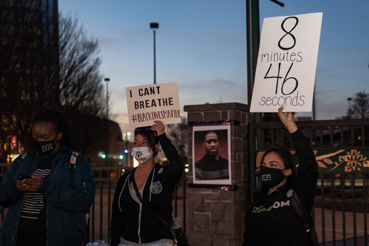 ATLANTA, GA - MARCH 08: Demonstrators hold a vigil in honor of George Floyd on March 8, 2021 in Atlanta, Georgia. Jury selection was paused today in the trial of former Minneapolis police officer Derek Chauvin, who is charged in Floyd's death. (Photo by Megan Varner/Getty Images)