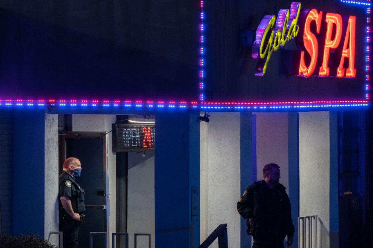 Police officers are seen outside a massage parlor where three people were shot and killed on March 16, 2021, in Atlanta, Georgia.