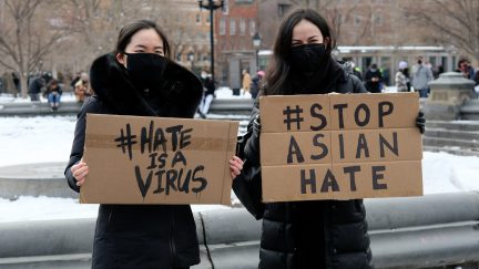 NEW YORK, NEW YORK - FEBRUARY 20: Protestors hold signs that read 