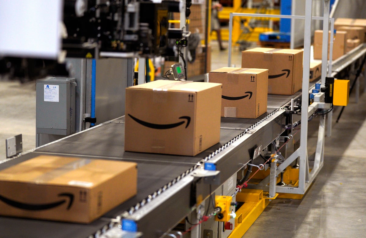 Packed orders move down a converyor belt at the Amazon fullfillment center