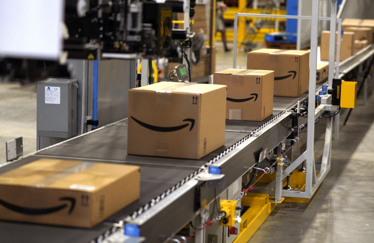 Packed orders move down a converyor belt at the Amazon fullfillment center