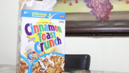 A box of cinnamon toast crunch on a table.