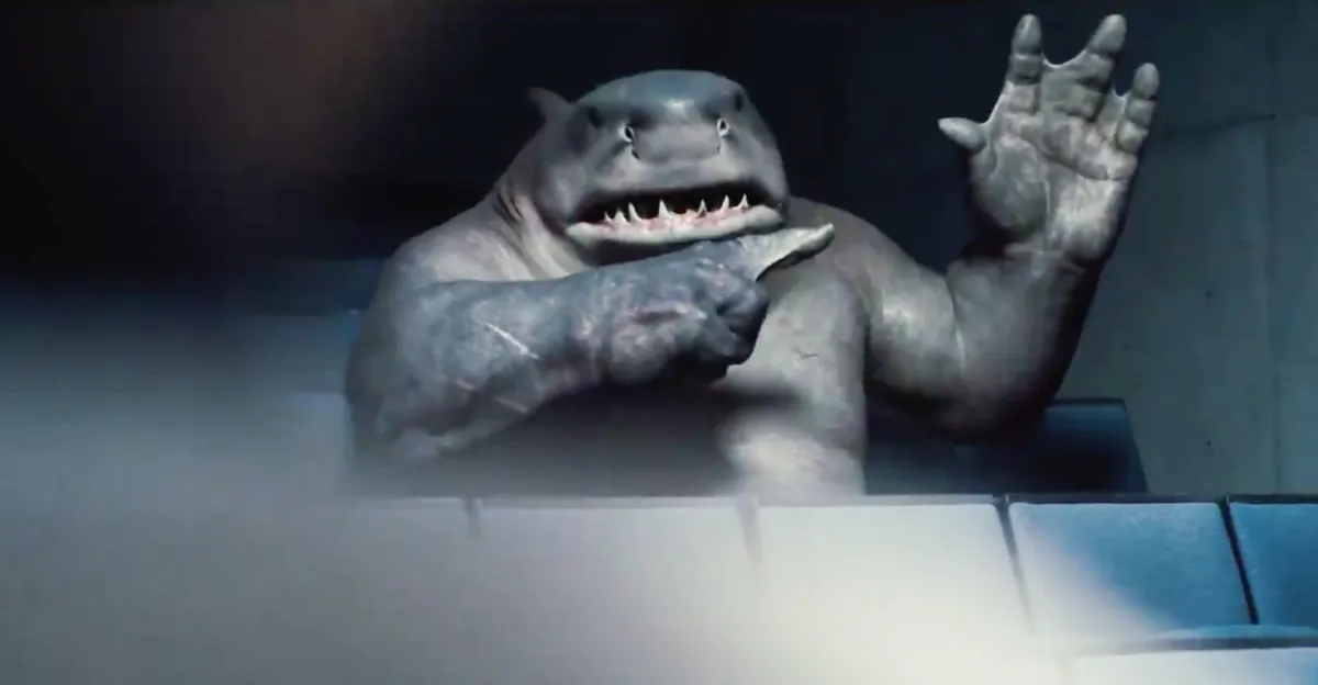 King Shark raising his hand and pointing at it in The Suicide Squad.