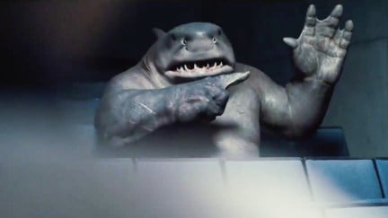 King Shark raising his hand and pointing at it in The Suicide Squad.