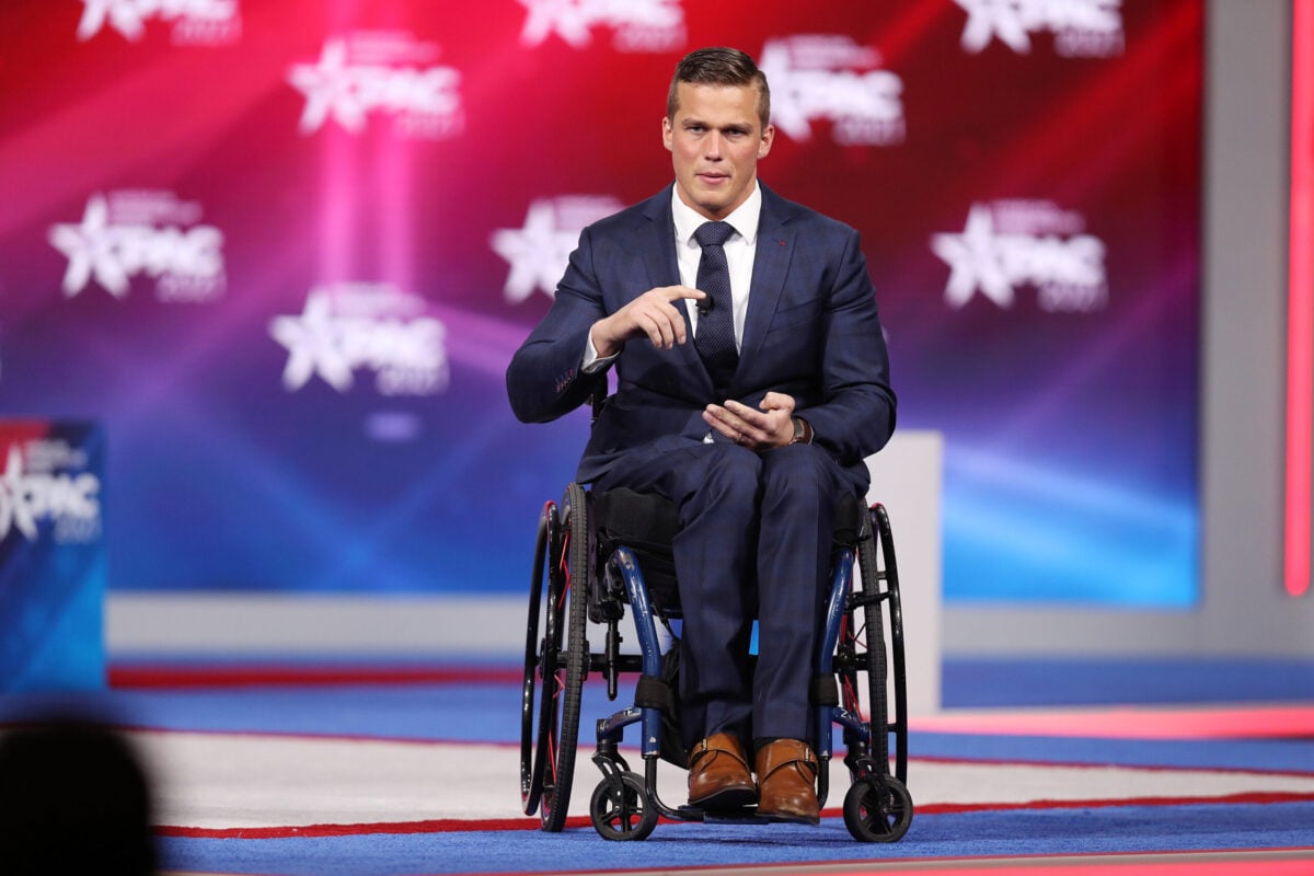 Rep. madison cawthorn in his wheelchair on the stage of CPAC