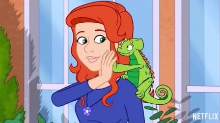 The new Ms Frizzle from Netflix's reboot of the Magic Schoolbus high fives her pet chameleon.