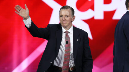 Rep. Paul Gosar waves from the stage at CPAC.