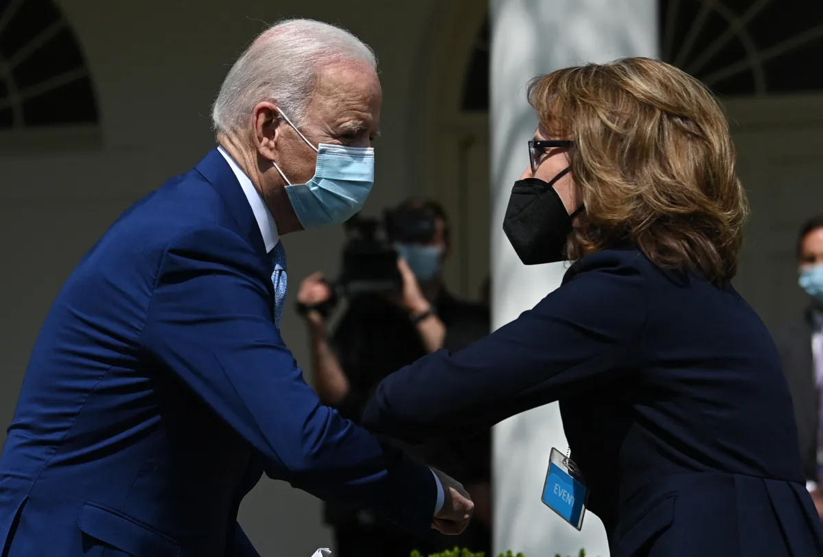 US President Joe Biden greets former US Representative Gabby Giffords after he spoke about gun violence prevention in the Rose Garden of the White House in Washington, DC, on April 8, 2021. - Biden unveiled measures aimed at curbing rampant US gun violence, especially seeking to prevent the spread of untraceable "ghost guns." (Photo by Brendan SMIALOWSKI / AFP) (Photo by BRENDAN SMIALOWSKI/AFP via Getty Images)