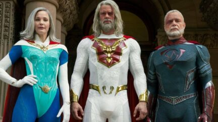 Netflix's Jupiter's Legacy cast Leslie Bibb, Josh Duhamel, and Ben Daniels standing in their characters' superhero uniforms.