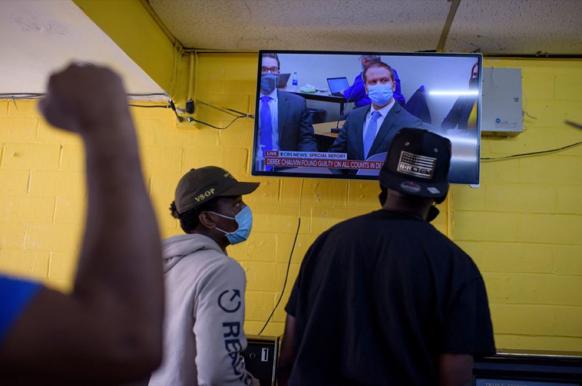 People inside the Twees Foods Store in the Third Ward where George Floyd grew up react at the verdict in Derek Chauvin's trial in Houston, Texas on April 20, 2021. - Sacked police officer Derek Chauvin was convicted of murder and manslaughter on april 20 in the death of African-American George Floyd in a case that roiled the United States for almost a year, laying bare deep racial divisions. (Photo by Mark Felix / AFP) (Photo by MARK FELIX/AFP via Getty Images)