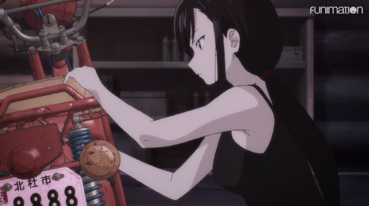 Reiko fixing her bike