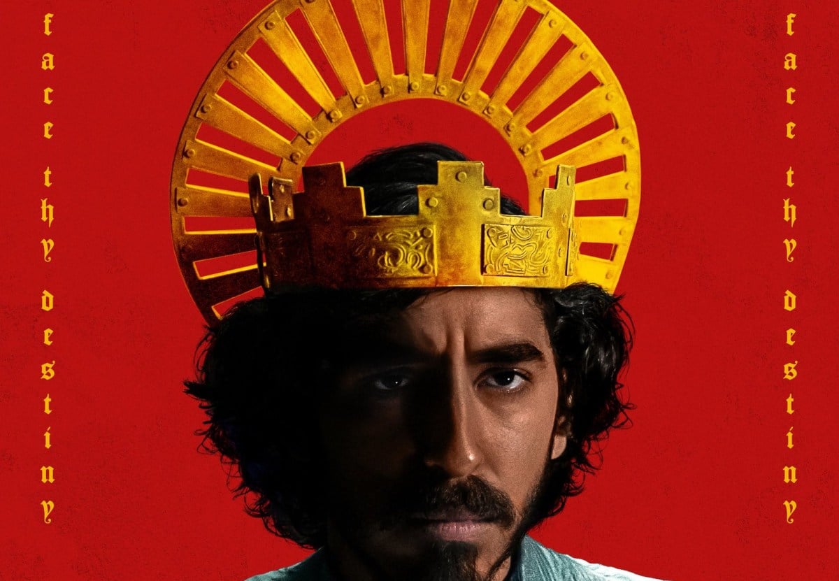 Dev Patel as Sir Gawain wears a crown in a promotional poster for The Green Knight movie