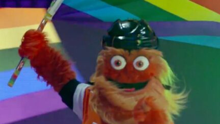 Gritty waving Pride flag while on the ice.