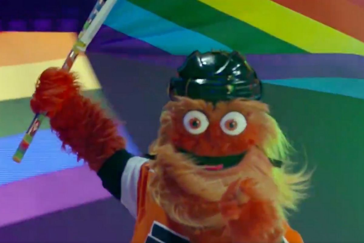 Gritty waving Pride flag while on the ice.
