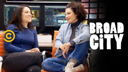 Abbi and Ilana chatting on a couch in Broad City.