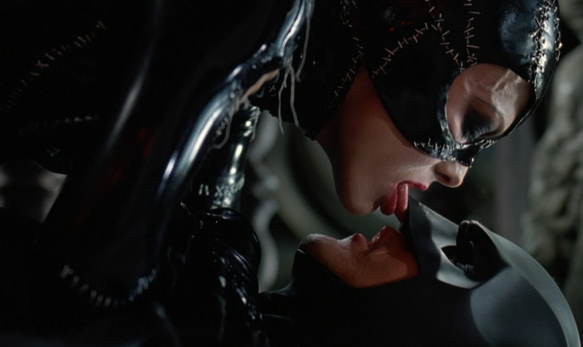batman can't go down on catwoman, but she can lick his face