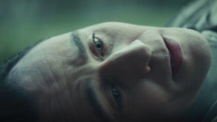 Tom Hiddleston lies on the ground as Loki in 'Loki' episode 4