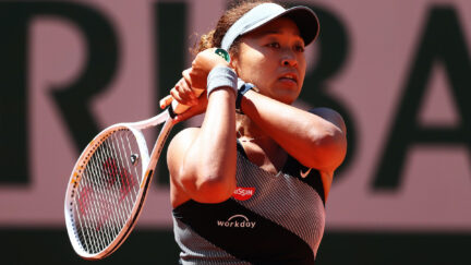 Tennis player Naomi Osaka plays a backhand