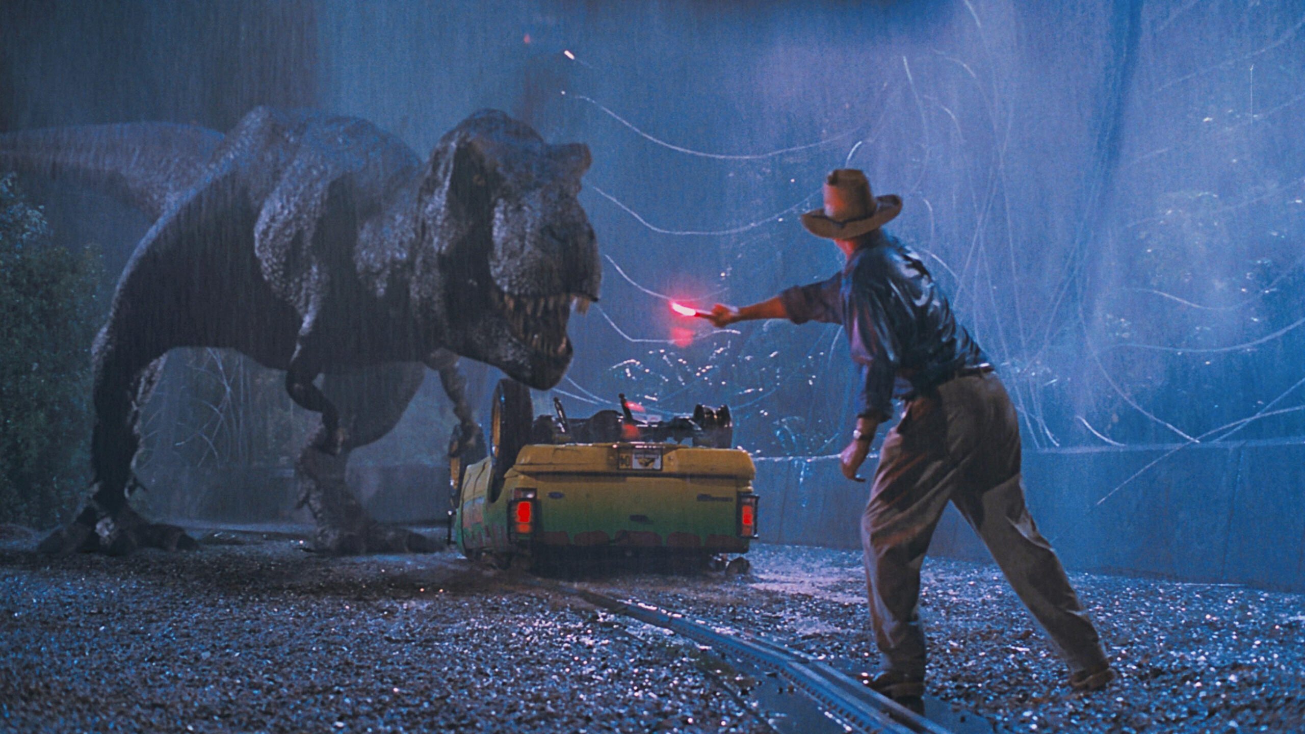 Dr. Grant waving a flare at the T-Rex in Jurassic Park.