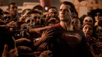 Superman with people flocking around him like a messianic figure on Batman v Superman.