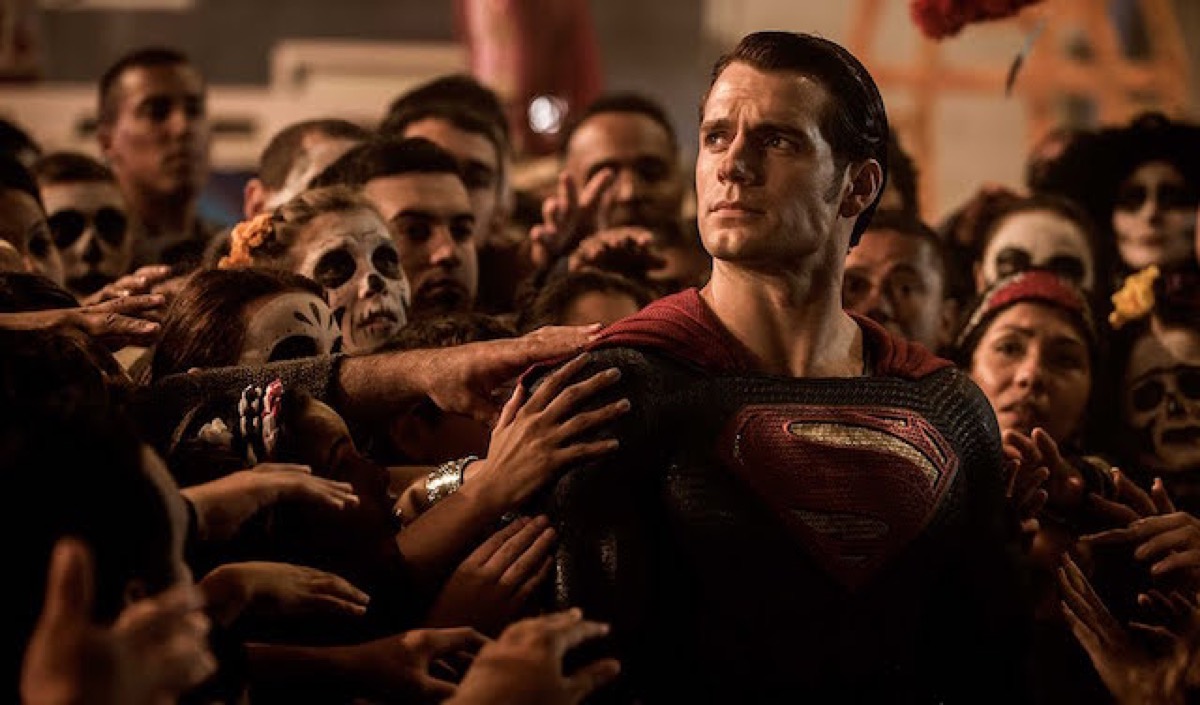 Superman with people flocking around him like a messianic figure on Batman v Superman.
