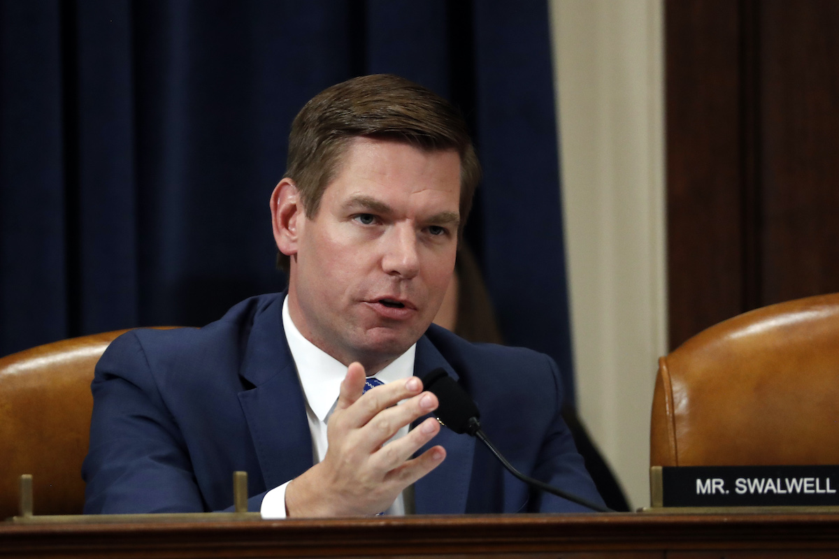 Rep. Eric Swalwell speaks from his desk in the House.