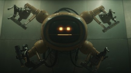 A robot with four arms and a round face made up of two square lights and a line.