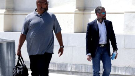 Officers Harry Dunn and Michael Fanone depart U.S. Capitol after meeting with House Minority Leader Kevin McCarthy.