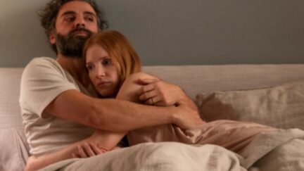 Oscar Isaac and Jessica Chastain hugging in bed in Scenes from a Marriage.