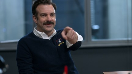 Jason Sudeikis points and smiles as Ted Lasso
