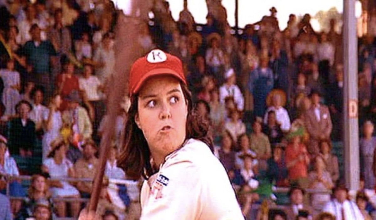 Rosie O'Donnell as Doris, getting ready to swing a baseball bat in A League of Their Own.