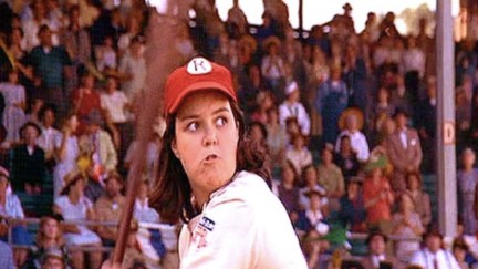 Rosie O'Donnell as Doris, getting ready to swing a baseball bat in A League of Their Own.