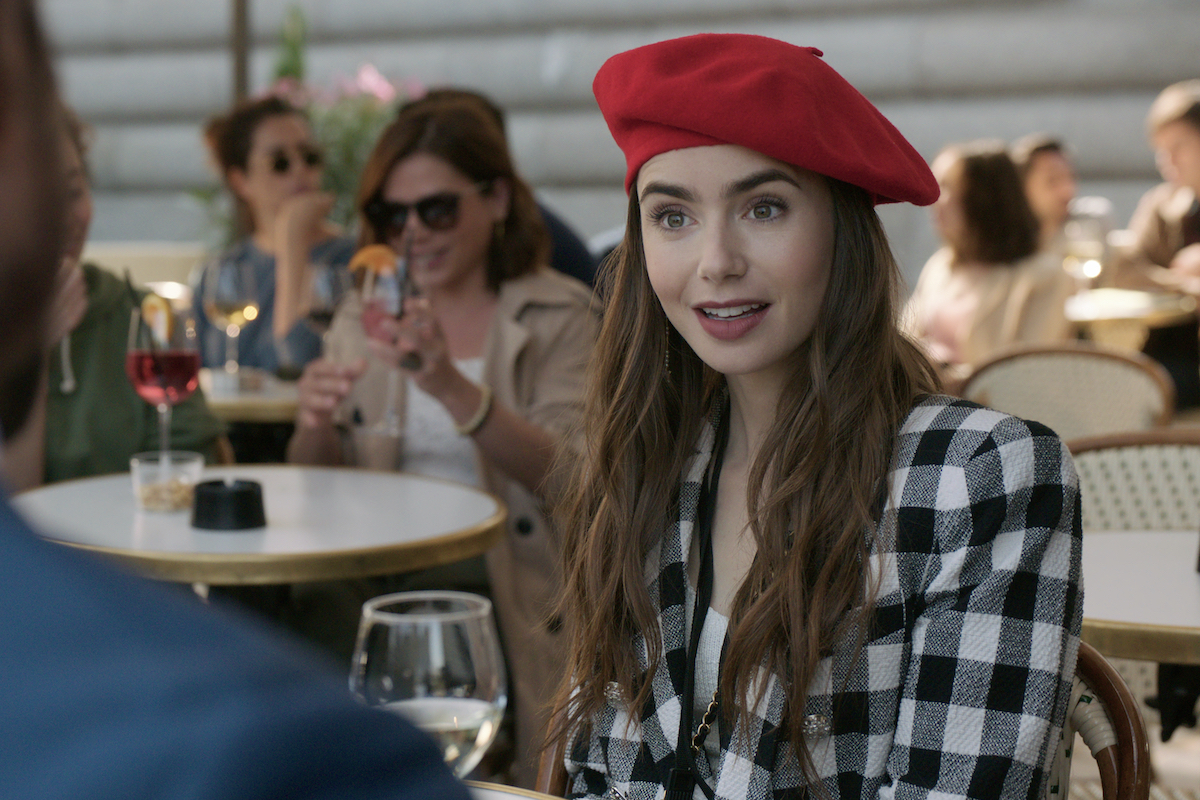 Lily Collins wears a red beret as Emily in Emily in Paris