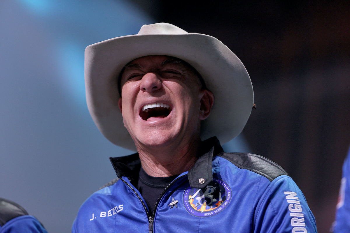 Jeff Bezos laughs while wearing a cowboy hat following his trip to space.