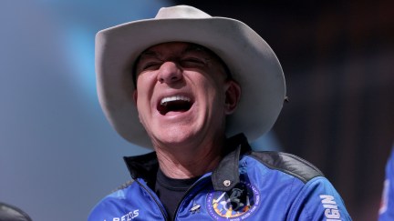 Jeff Bezos laughs while wearing a cowboy hat following his trip to space.